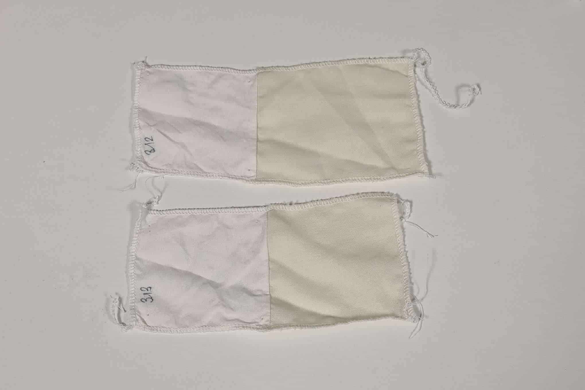 Kaksi kangaspalaa, joissa on kahta erilaista valkoisen sävyä.