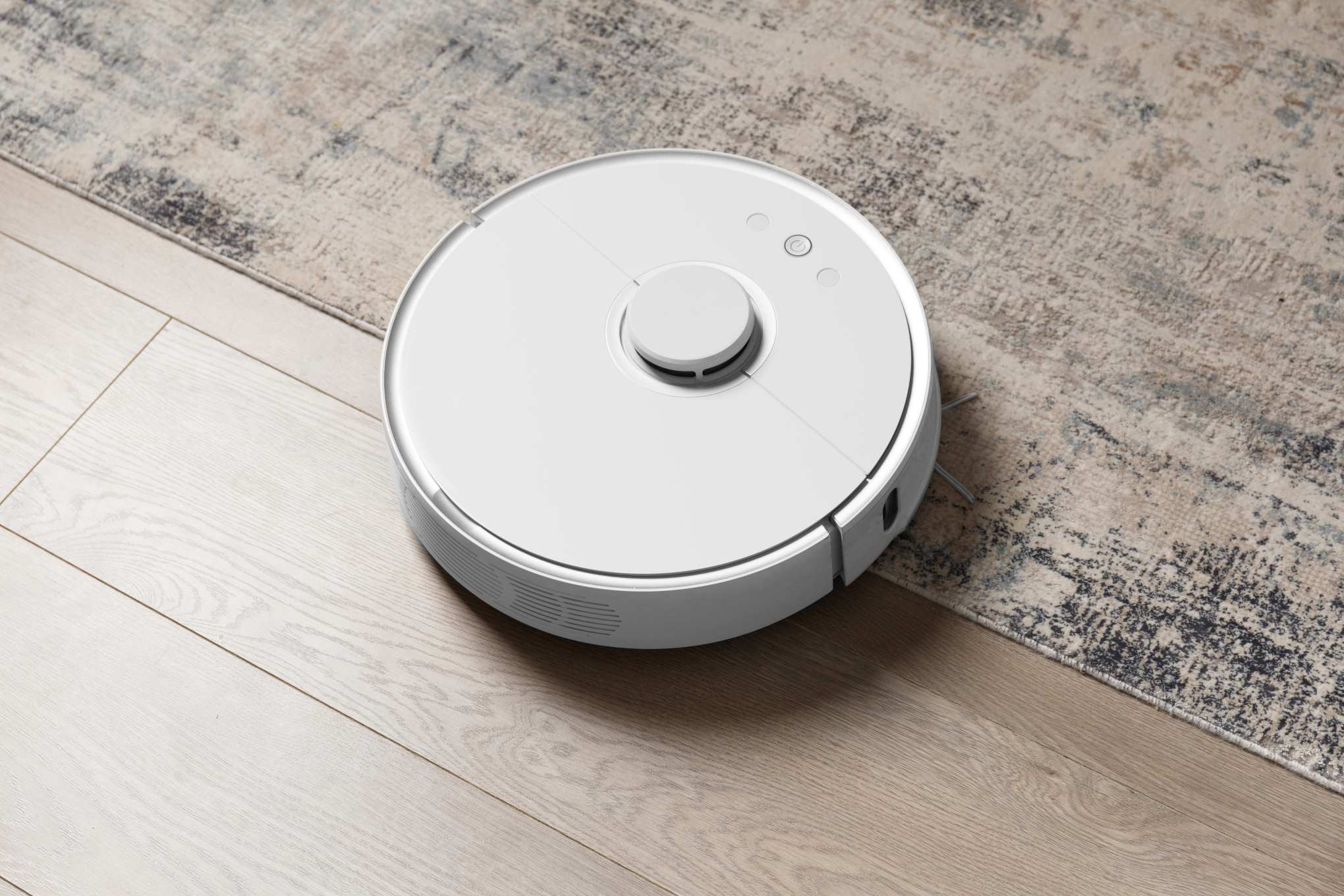 Valkoinen robotti-imuri.