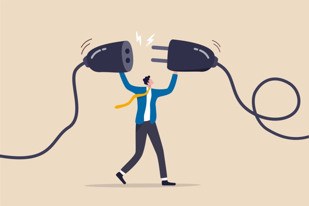 Piirroskuva henkilöstä, jolla on käsissään sähköjohdot.